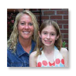 Mother and daughter smiling at the camera