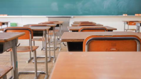 An empty classroom with desks