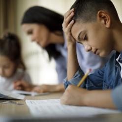 A frustrated boy doing homework