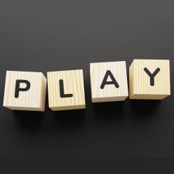 Wood blocks that spell "PLAY"