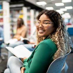 A smiling and confident girl in a school discussion group
