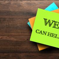 Sticky note that says "We Can Help"