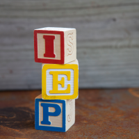 Stacked letter blocks that spell IEP
