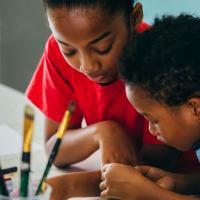 Boy and girl  working together on a project