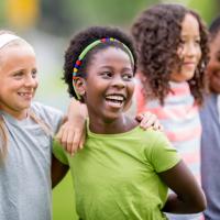 A group of young children laughing